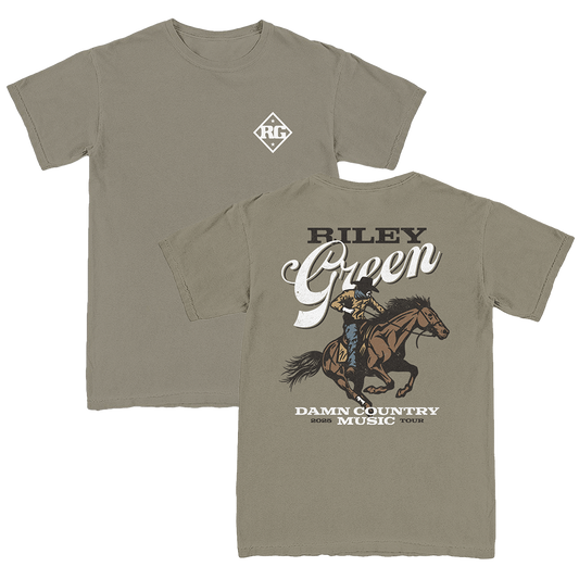 A green t-shirt with a graphic print of a cowboy riding a horse and the text 'BILLY GREEN DAMN COUNTRY MUSIC'.