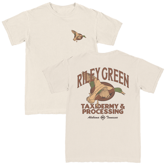 Ivory colored T-shirt with front and back print featuring an illustration of a duck and the text 'Riley Green Taxidermy & Processing'.