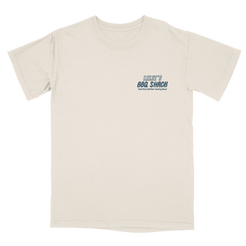 Beige t-shirt with blue and green text on a white background. Riley's BBQ Shack Riley Green