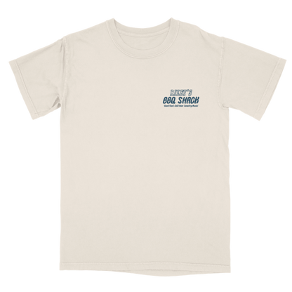 Beige t-shirt with blue and green text on a white background. Riley's BBQ Shack Riley Green